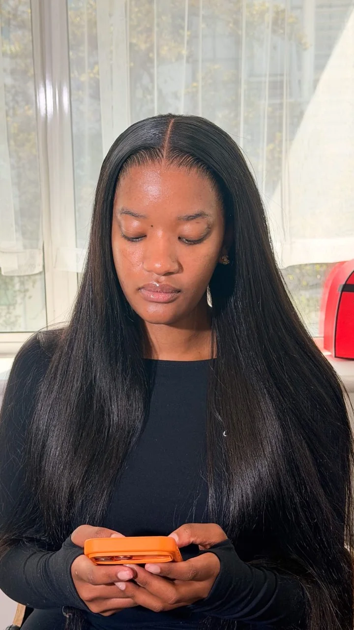 Long sleek centre-part wig installation by BY LIS
